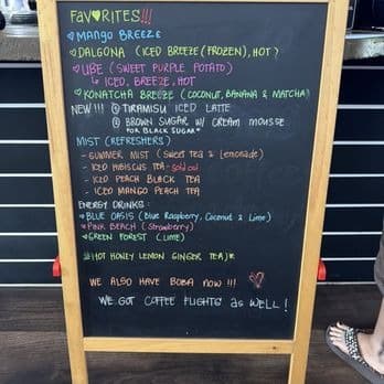 Koffee Paradise chalkboard listing favorites like mango breeze, dalgona, ube and Konatcha breeze